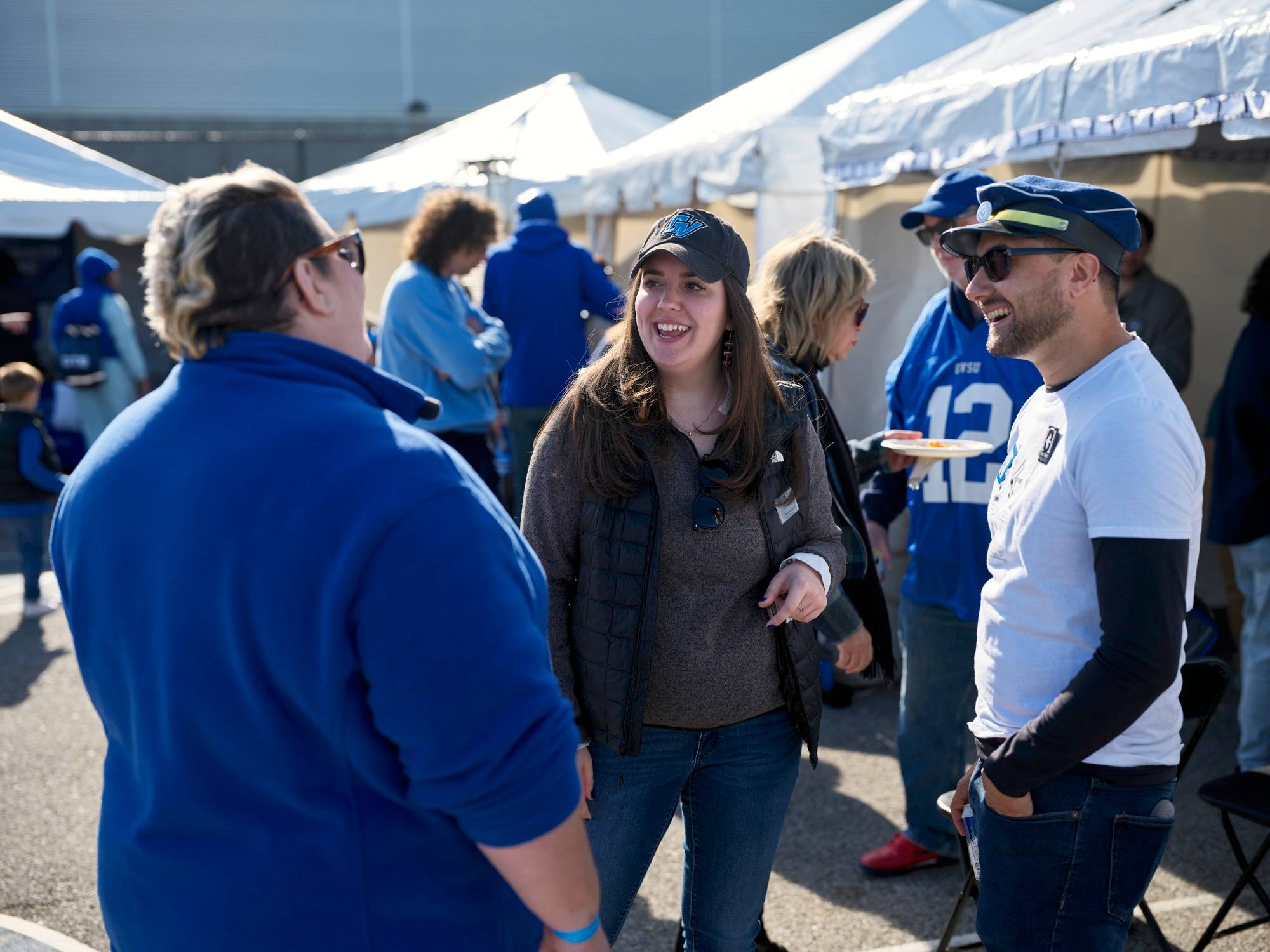 Alumni chat at Reunion Row